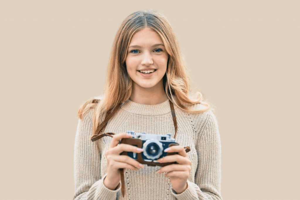 a girl holding a camera