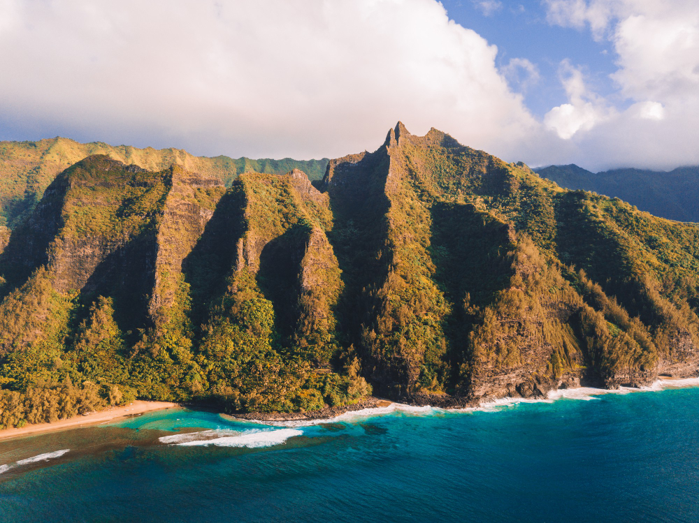 aerial view of the na pali coast cliffs in hawaii