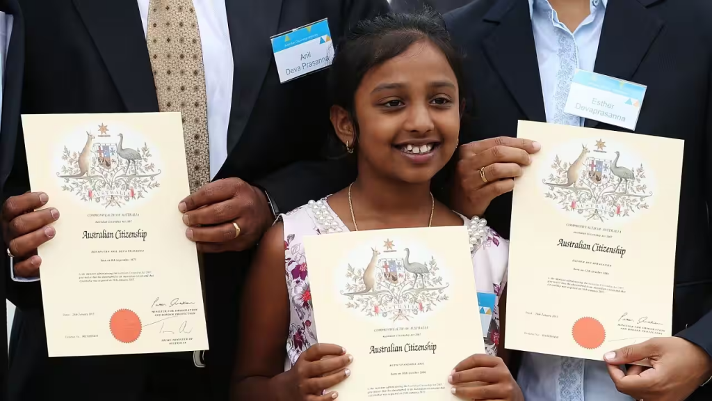 a girl holding an Australia citizenship certificate