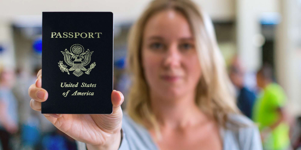 a woman holding a us passport