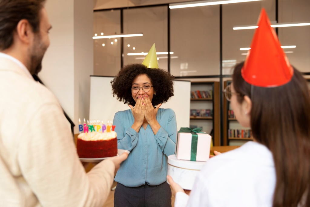 coworkers celebrating birthday at office