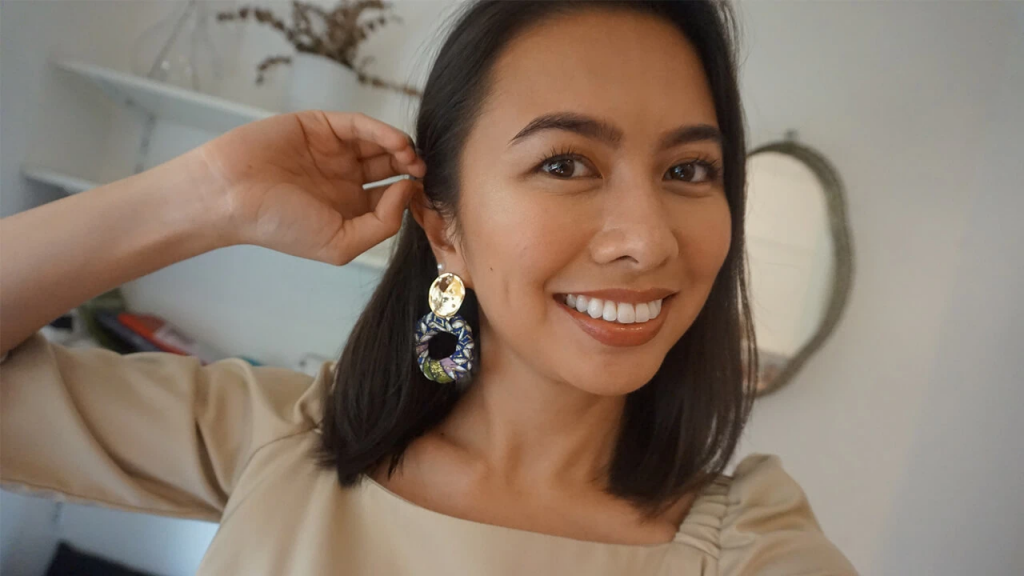 a woman wearing earrings