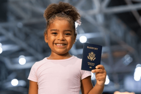 a child holding a us passport