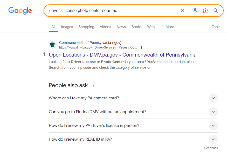 Searching “driver's license photo center near me” on Google
