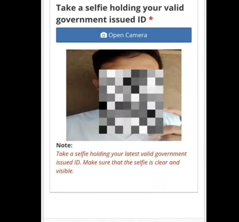 Upload a selfie that you hold a valid government-issued ID to prove your identity