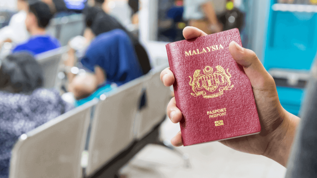 a person holding a Malaysian passport